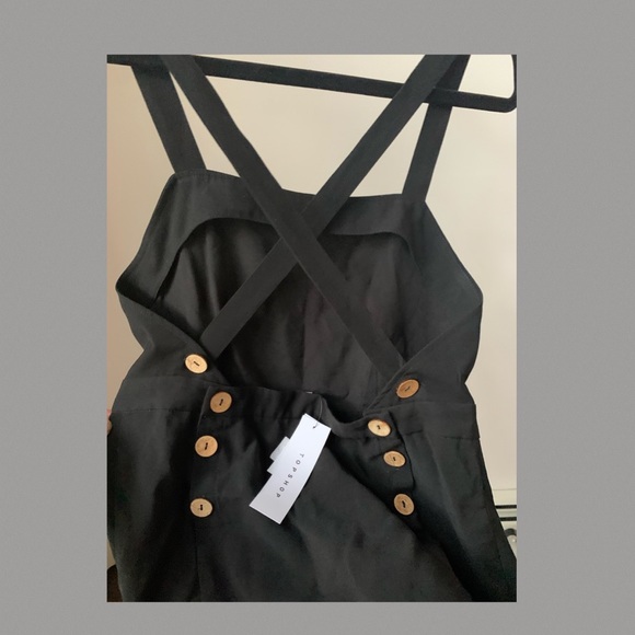 Black crisscross straps to the back with buttons. - Picture 1 of 10